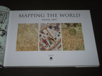 2006 MAPPING THE WORLD HARDCOVER BOOK BY MICHAEL SWIFT - I 1733