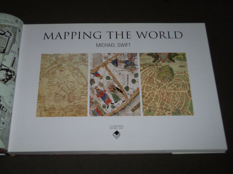 2006 MAPPING THE WORLD HARDCOVER BOOK BY MICHAEL SWIFT - I 1733