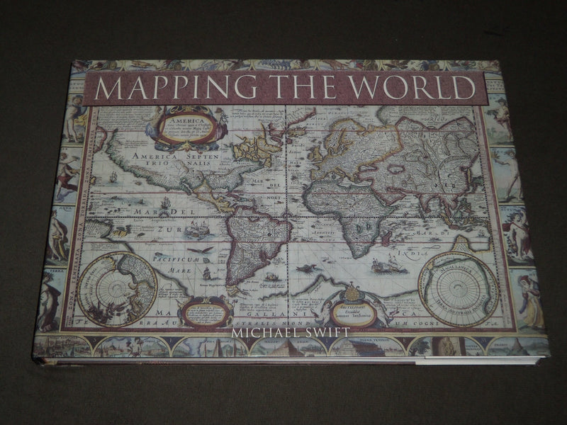 2006 MAPPING THE WORLD HARDCOVER BOOK BY MICHAEL SWIFT - I 1733