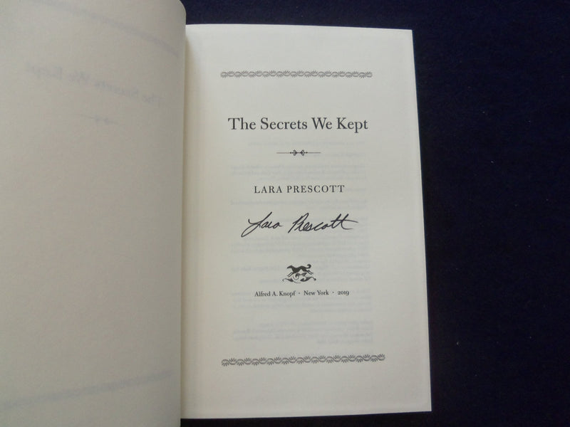 2019 THE SECRETS WE KEPT HARDCOVER BOOK - AUTOGRAPHED BY LARA PRESCOTT - KD 8523